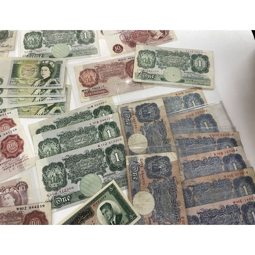 13A - A large collection of mainly British bank notes to include 10 Shilling notes, £1 Pound notes and £5 ... 
