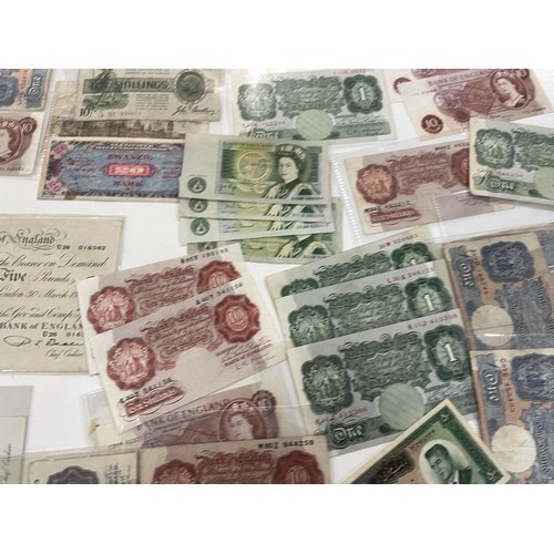 13A - A large collection of mainly British bank notes to include 10 Shilling notes, £1 Pound notes and £5 ... 