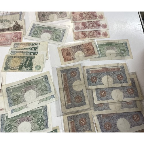 13A - A large collection of mainly British bank notes to include 10 Shilling notes, £1 Pound notes and £5 ... 