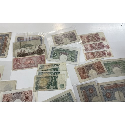 13A - A large collection of mainly British bank notes to include 10 Shilling notes, £1 Pound notes and £5 ... 