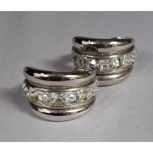 16 - YSL- A pair of late 20th Century YSL silver tone and white crystal clip on hoop earrings, made in Fr... 