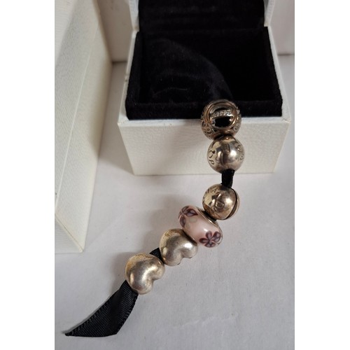 25 - Pandora- A silver charm bracelet with heart clasp stamped S925 Ale to the inside together with 10 si... 
