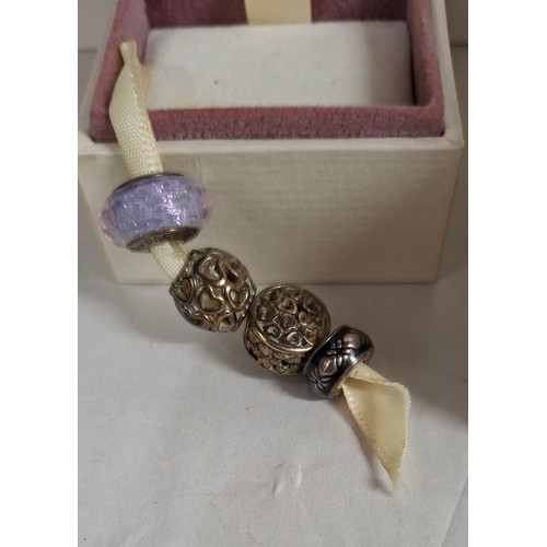 25 - Pandora- A silver charm bracelet with heart clasp stamped S925 Ale to the inside together with 10 si... 