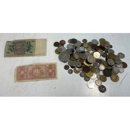 60 - A collection of world coins and bank notes to include coins from Sweden, Spain, Zimbabwe and others.... 