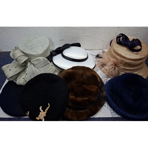 236 - A group of vintage hats to include an Emma B beige straw formal hat and a 1960's/70's Simpson gents ... 