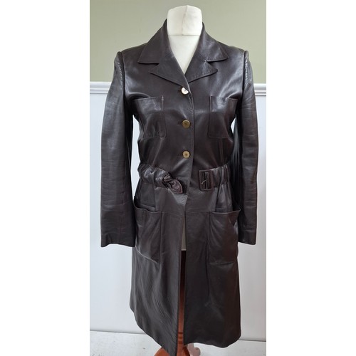 4 - Chanel- An Autumn 2001 ladies brown lambs leather fitted trench coat having a gathered waistband wit... 