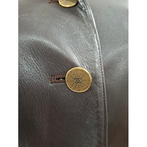 4 - Chanel- An Autumn 2001 ladies brown lambs leather fitted trench coat having a gathered waistband wit... 