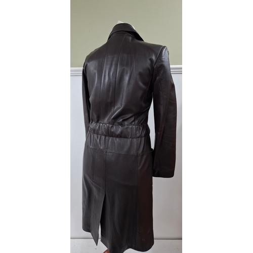 4 - Chanel- An Autumn 2001 ladies brown lambs leather fitted trench coat having a gathered waistband wit... 