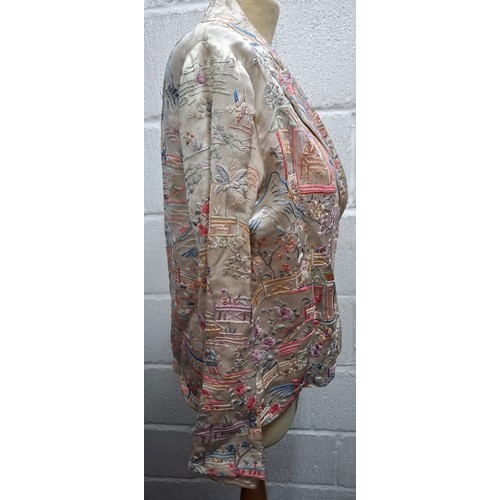 5 - A 1930's Chinese cream silk jacket having embroidered images of garden scenes in pinks, lilac, peach... 