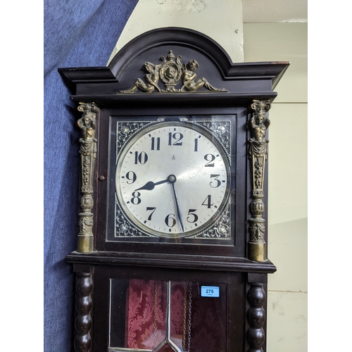 275 - A German oak cased longcase clock, the silvered dial with arabic numerals and pierced spandrels, mar... 