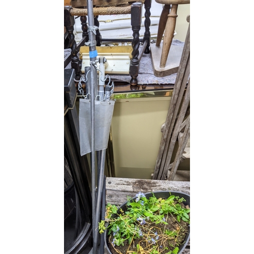 262 - A selection of weathered garden concrete and terracotta planters and pots, to include a concrete tro... 