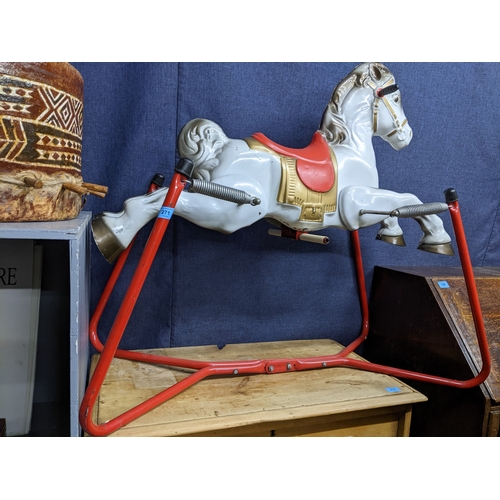 271 - A Mobo Prairie King white finished child's spring rocking horse with red and gold painted saddle.
Lo... 
