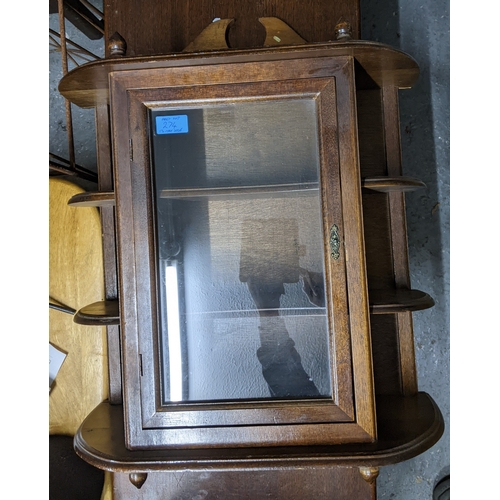 274 - An Art Deco walnut bow fronted display cabinet, twin glazed doors below an extended back, glass inte... 
