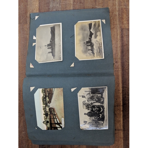 191 - A scrapbook containing photographs of conflicts, photos of landmark and some postcards of landmarks ... 