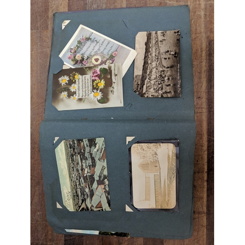 191 - A scrapbook containing photographs of conflicts, photos of landmark and some postcards of landmarks ... 