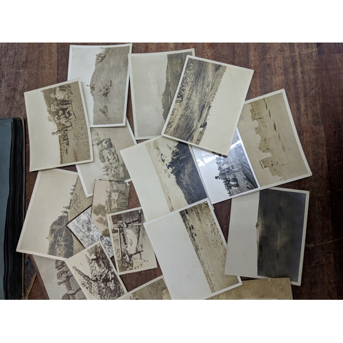 191 - A scrapbook containing photographs of conflicts, photos of landmark and some postcards of landmarks ... 