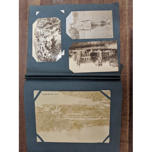 191 - A scrapbook containing photographs of conflicts, photos of landmark and some postcards of landmarks ... 