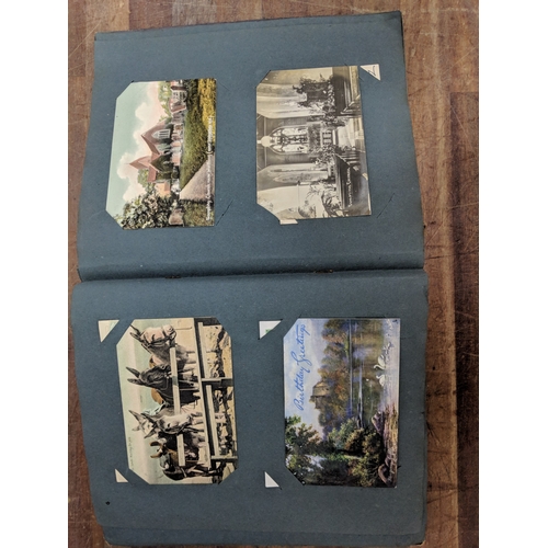 191 - A scrapbook containing photographs of conflicts, photos of landmark and some postcards of landmarks ... 