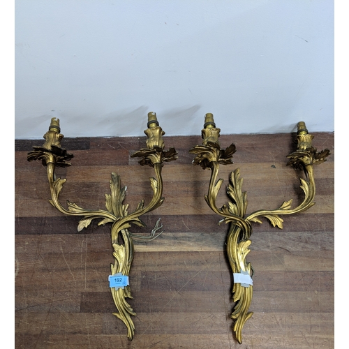 192 - A pair of French Louis XV style brass wall sconces with a gilded finish
Location:
If there is no con... 