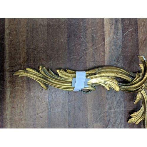 192 - A pair of French Louis XV style brass wall sconces with a gilded finish
Location:
If there is no con... 