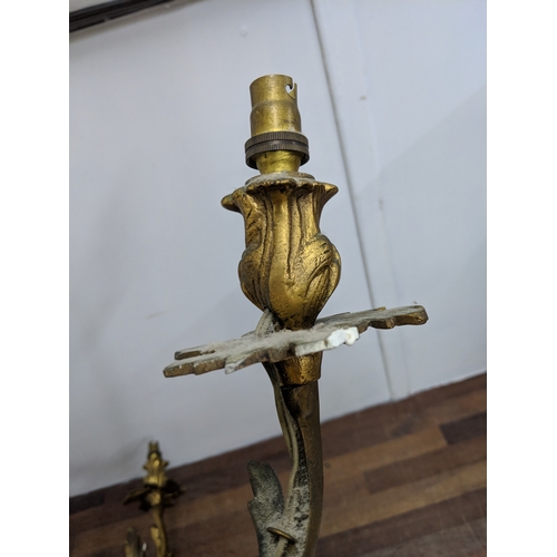 192 - A pair of French Louis XV style brass wall sconces with a gilded finish
Location:
If there is no con... 