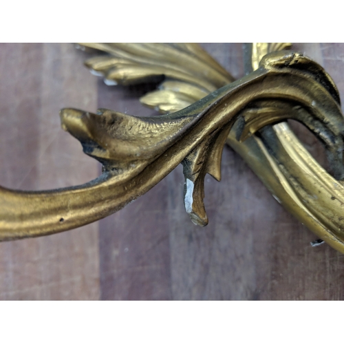 192 - A pair of French Louis XV style brass wall sconces with a gilded finish
Location:
If there is no con... 