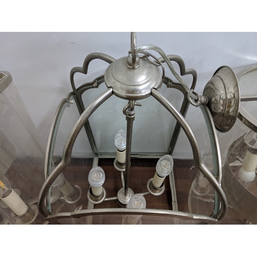 195 - A pair of modern chrome framed centre lights and another similar Location:
 If there is no condition... 