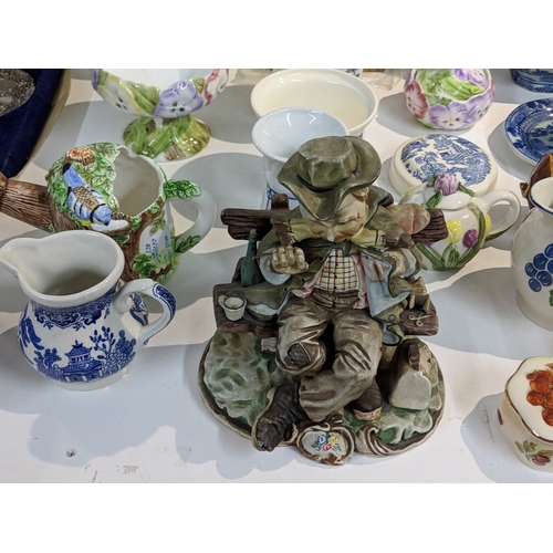 203 - A mixed lot to include blue and white china, Lurpak promotional items, modern beer steins, The Villa... 