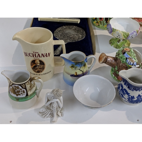 203 - A mixed lot to include blue and white china, Lurpak promotional items, modern beer steins, The Villa... 
