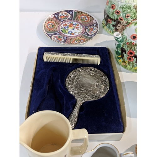 203 - A mixed lot to include blue and white china, Lurpak promotional items, modern beer steins, The Villa... 