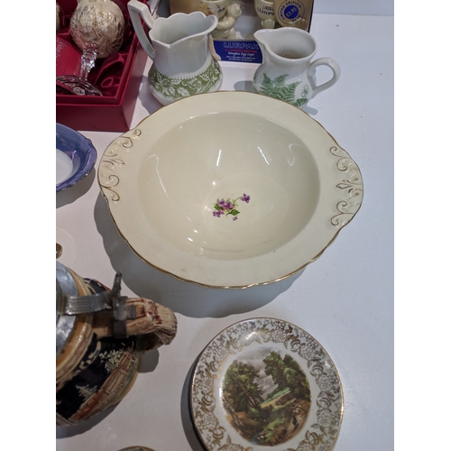203 - A mixed lot to include blue and white china, Lurpak promotional items, modern beer steins, The Villa... 