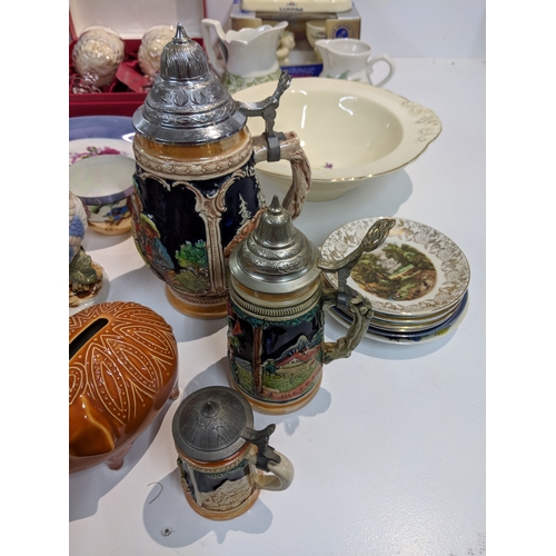 203 - A mixed lot to include blue and white china, Lurpak promotional items, modern beer steins, The Villa... 