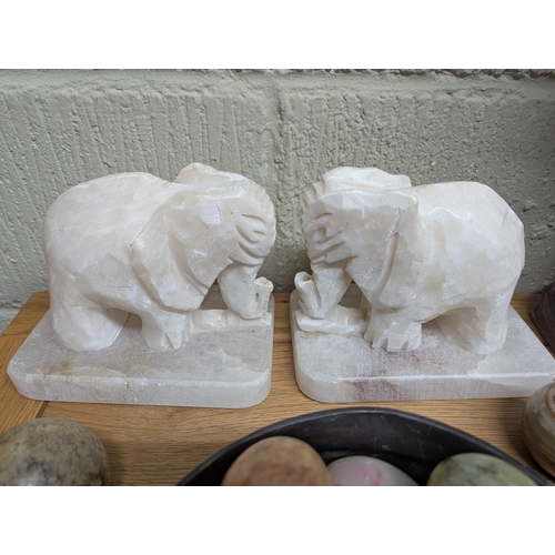 326 - Collectables to include a hardwood carved elephant sculpture signed to the base, a pair of white mar... 
