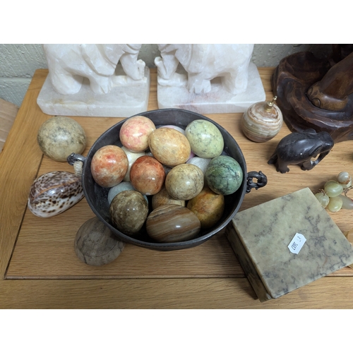 326 - Collectables to include a hardwood carved elephant sculpture signed to the base, a pair of white mar... 
