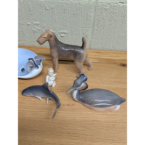 329 - Royal Copenhagen to include a Great Crested grebe, n Airedale terrier and a fawn and other items, so... 