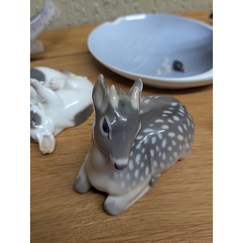 329 - Royal Copenhagen to include a Great Crested grebe, n Airedale terrier and a fawn and other items, so... 