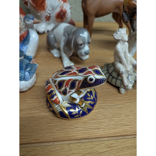 333 - A collection of ceramic figurines, mainly modelled as various animals to include a Royal Crown Derby... 