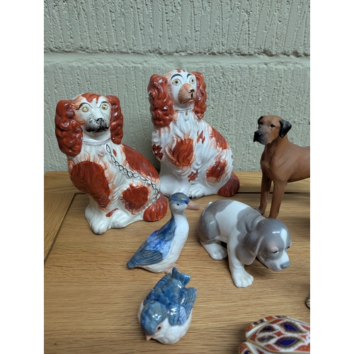 333 - A collection of ceramic figurines, mainly modelled as various animals to include a Royal Crown Derby... 