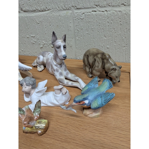 333 - A collection of ceramic figurines, mainly modelled as various animals to include a Royal Crown Derby... 
