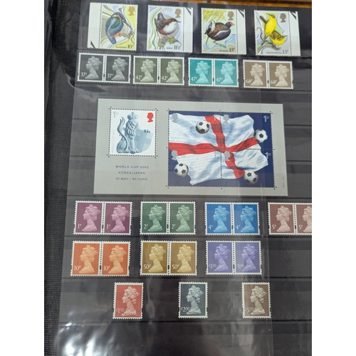 52 - An album filled with Royal Mail postage stamps to include over 100 first class examples along with o... 