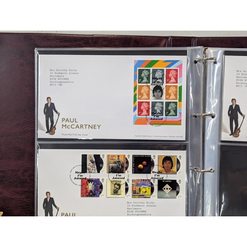 59 - A large collection of First Day covers to include commemorative examples and others housed within al... 