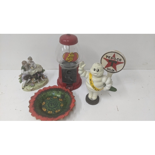 239 - Novelty items to include a cast iron Michelin Man, a Jelly Belly sweet dispenser and other items Loc... 