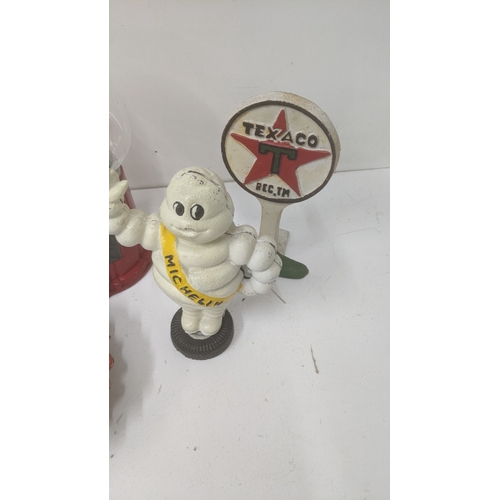 239 - Novelty items to include a cast iron Michelin Man, a Jelly Belly sweet dispenser and other items Loc... 