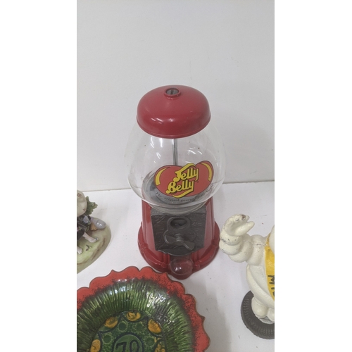 239 - Novelty items to include a cast iron Michelin Man, a Jelly Belly sweet dispenser and other items Loc... 