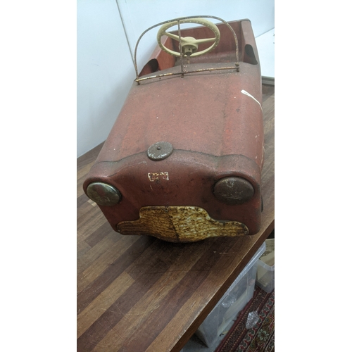 242 - A vintage Triang cast metal child's pedal car named Thunderbold Location:
If there is no condition r... 