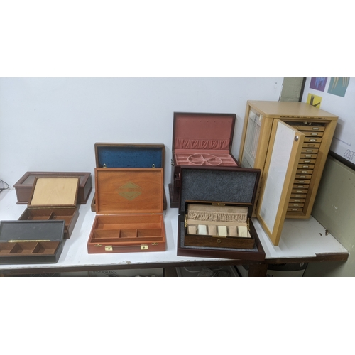 247 - Display and collectors boxes to include a rotating Condor watch strap display cabinet, a Thomas Pacc... 