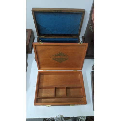 247 - Display and collectors boxes to include a rotating Condor watch strap display cabinet, a Thomas Pacc... 