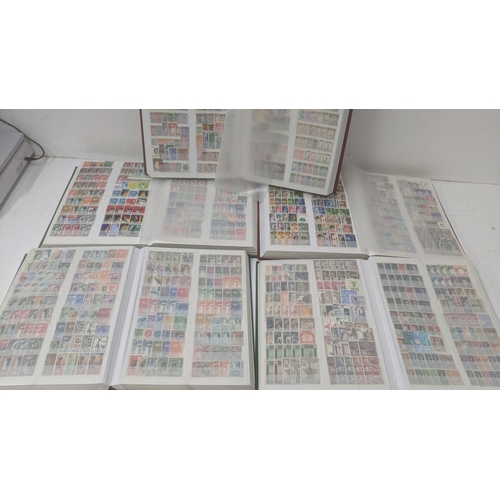 249 - A collection of stamps from around the world housed in five albums from Brazil, Egypt, Ghana, Poland... 