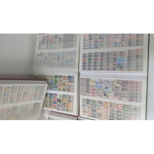 249 - A collection of stamps from around the world housed in five albums from Brazil, Egypt, Ghana, Poland... 