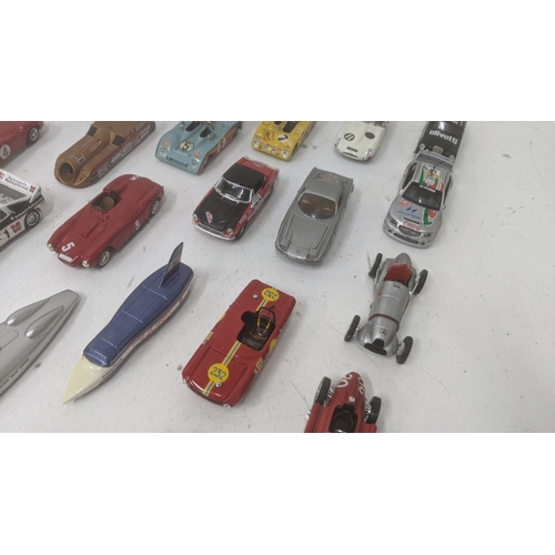 376 - A collection of 1:43 scale diecast model racing cars to include a Best Models E-Type Jaguar, a Top m... 